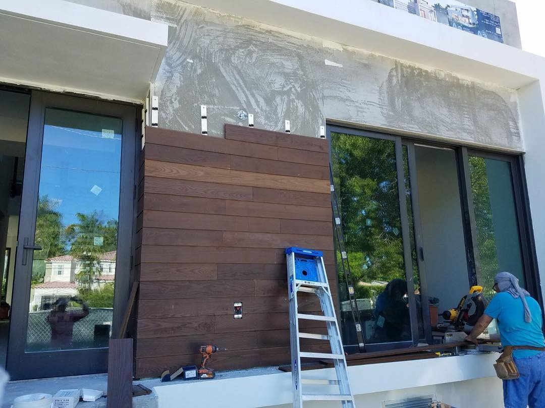 Wood exterior cladding installation on custom home